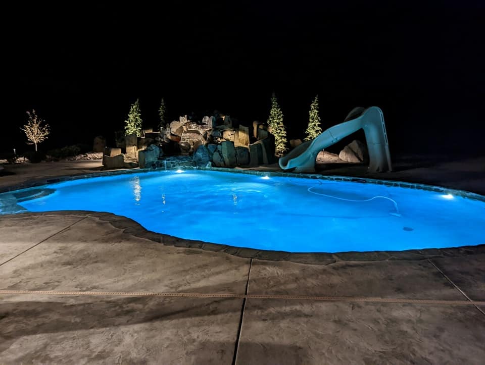 Night view pool with custom waterfall